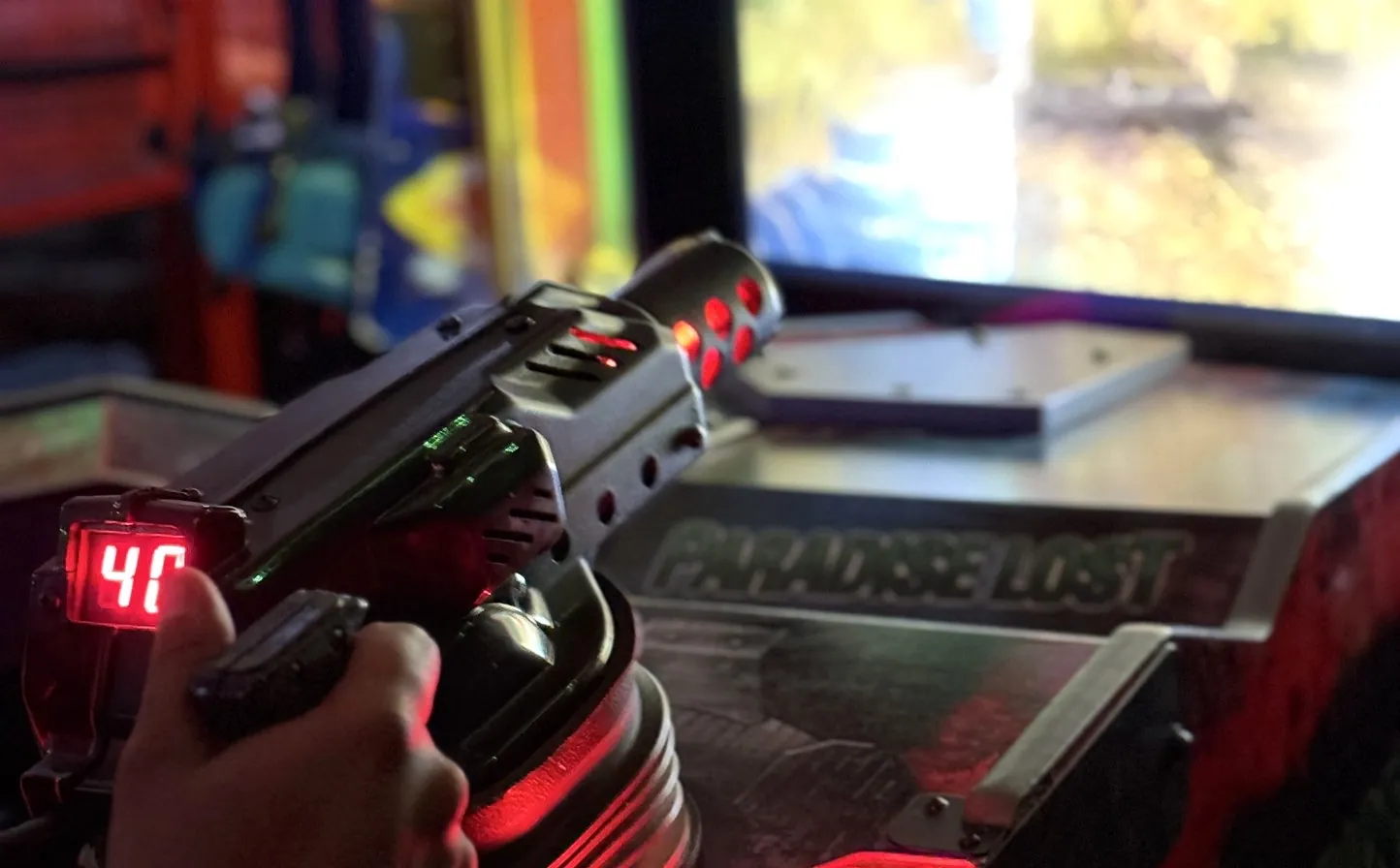A light gun at an arcade cabinet