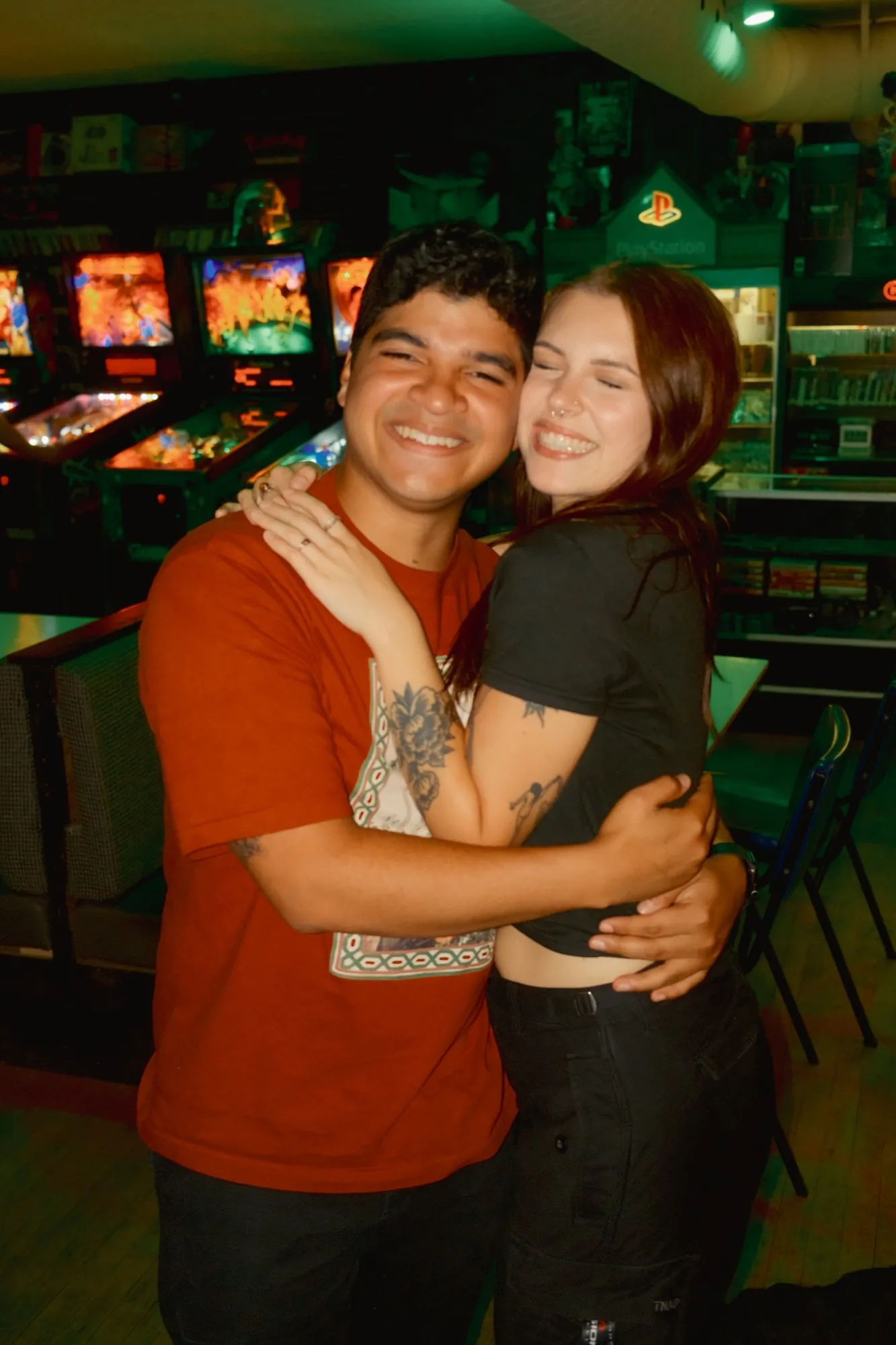 A couple hugging on the couch after a round of Mario Kart