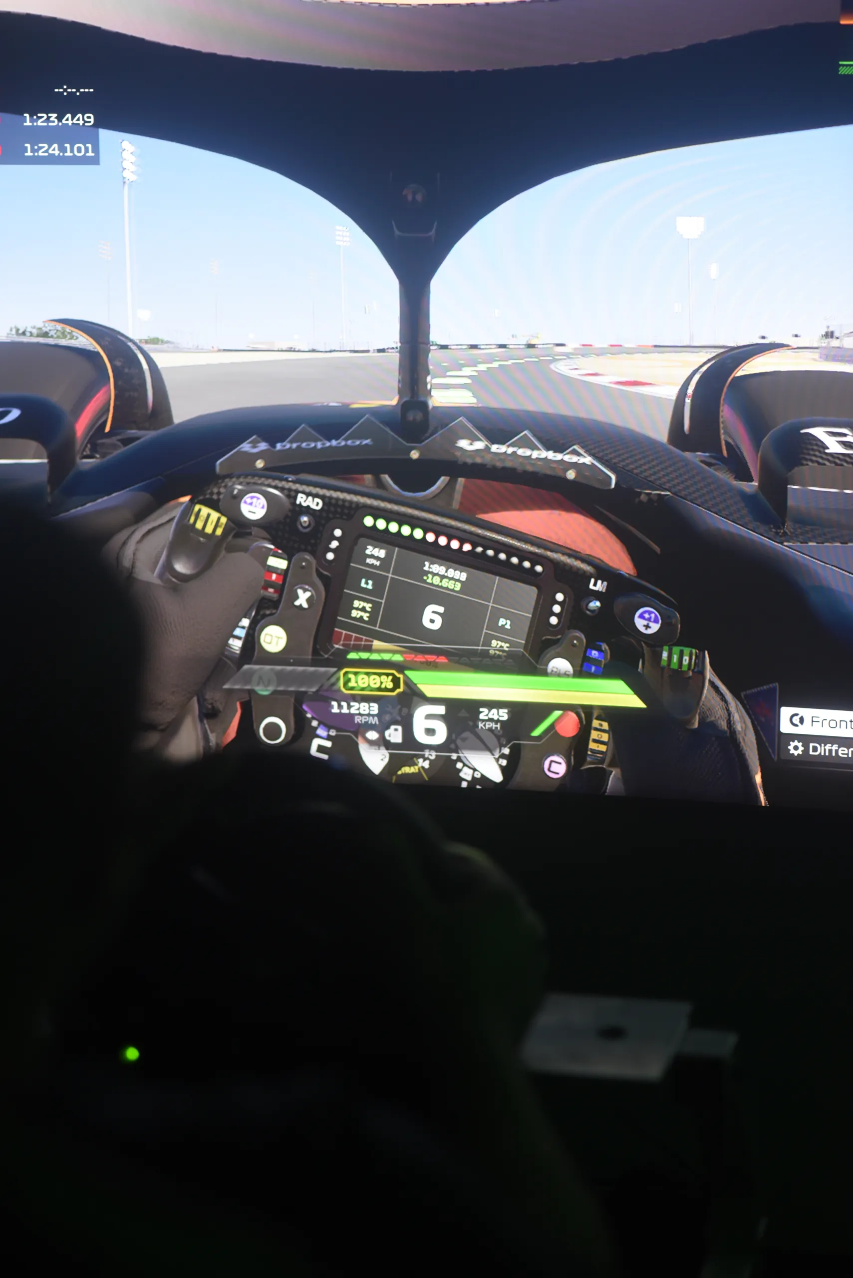 Cockpit view of an F1 car on track on the racing sim screen