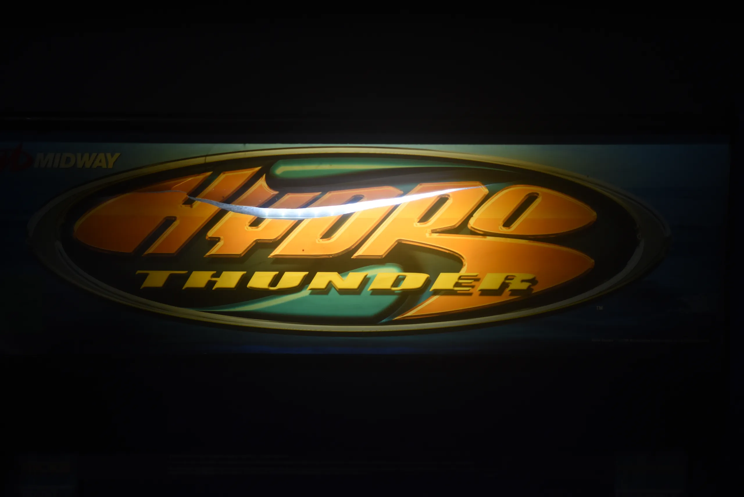 Hydro Thunder arcade marquee lit up in gold
