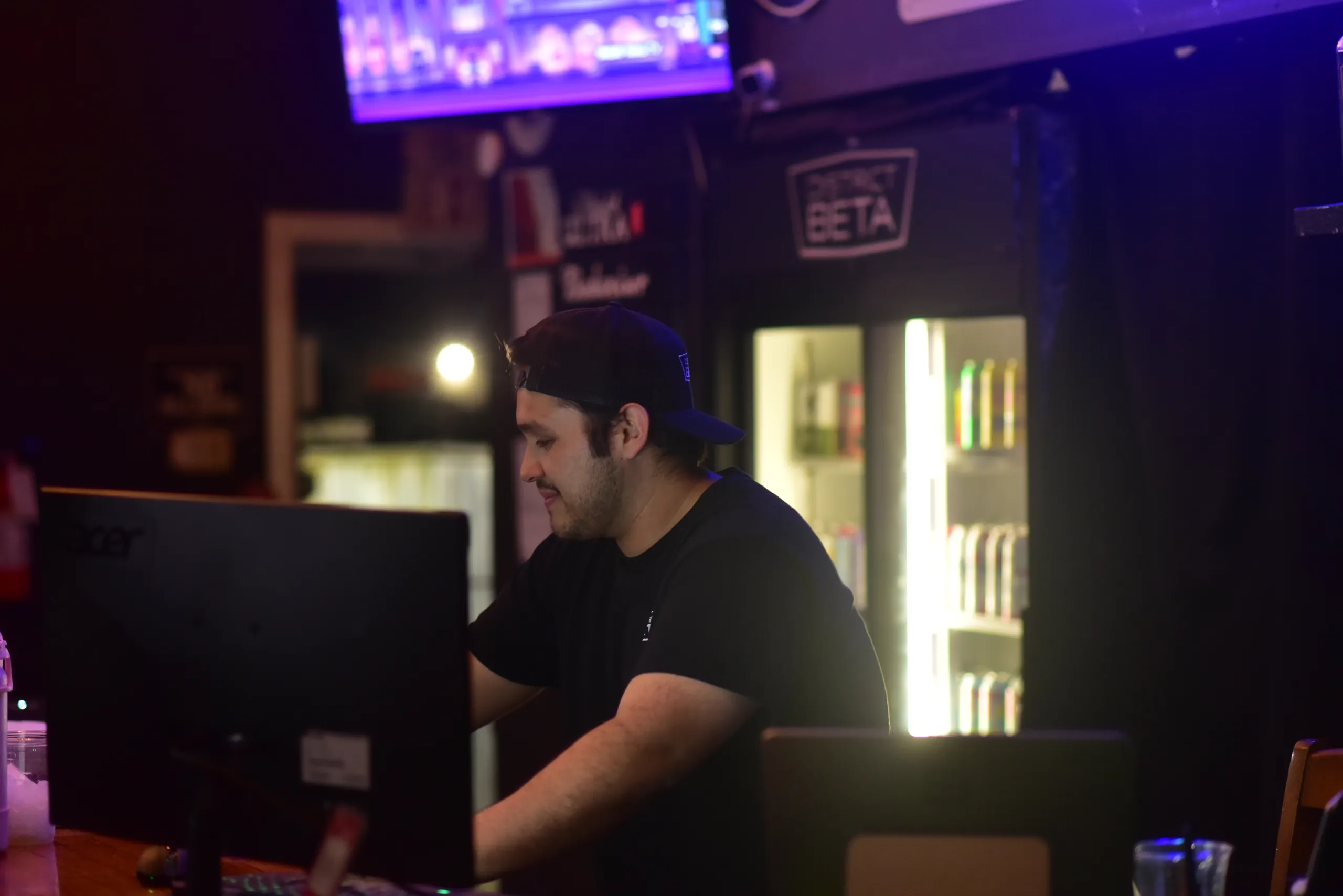 A District Beta staff member working the front counter