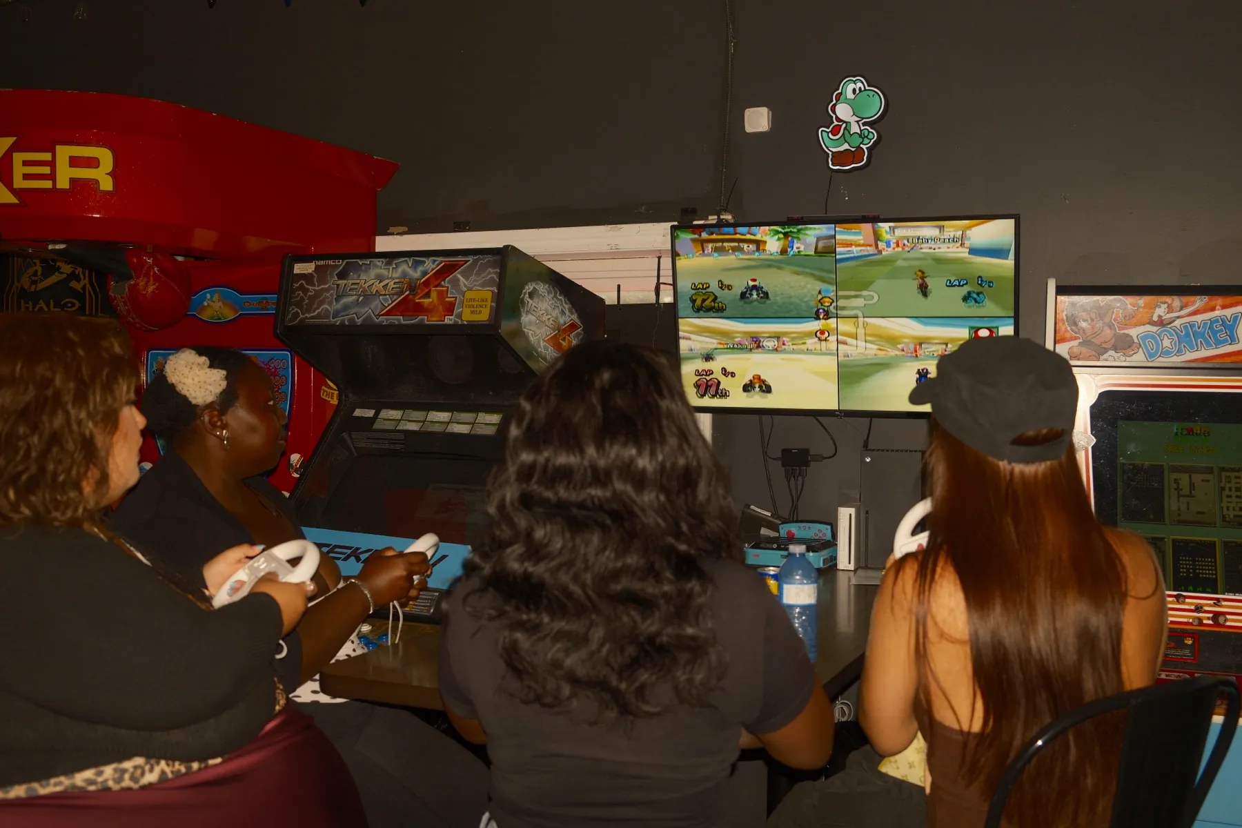 Guests racing at the Mario Kart arcade cabinets