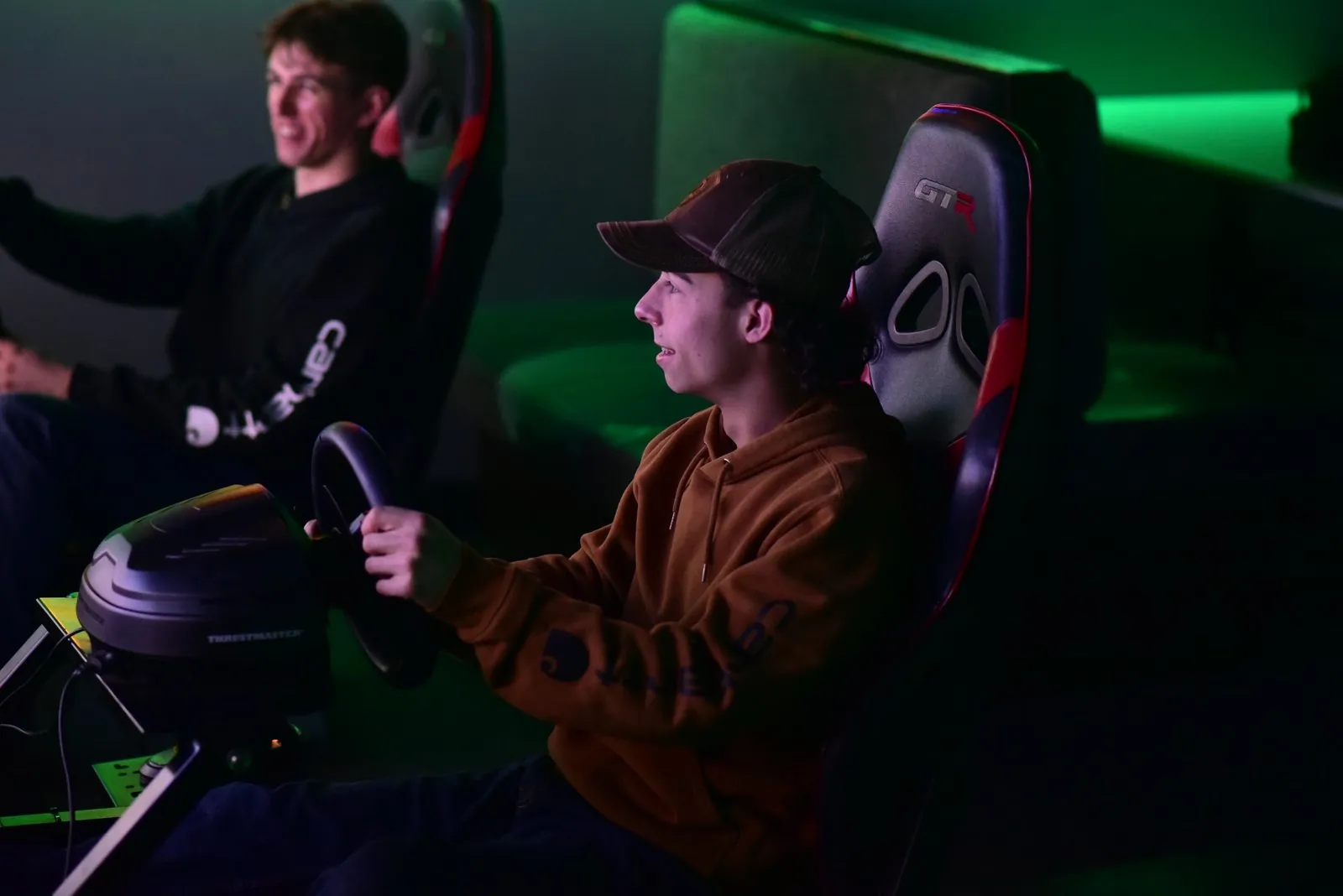 Two players racing side by side on the sims