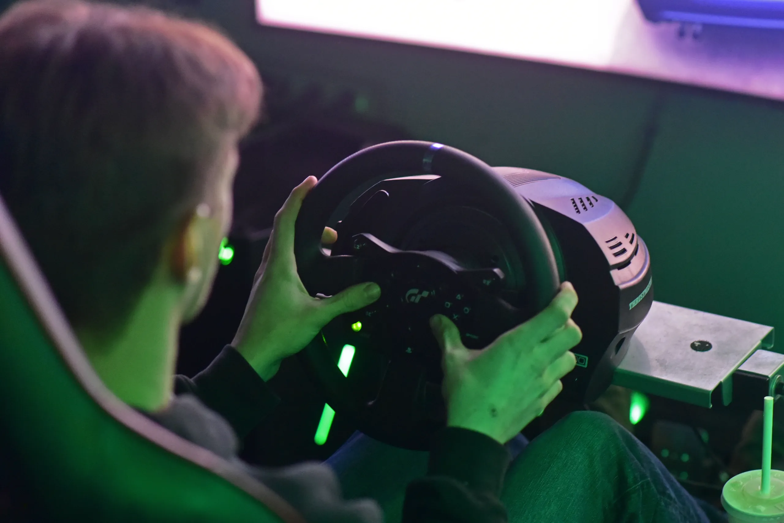 Hands on the wheel of one of our racing sims