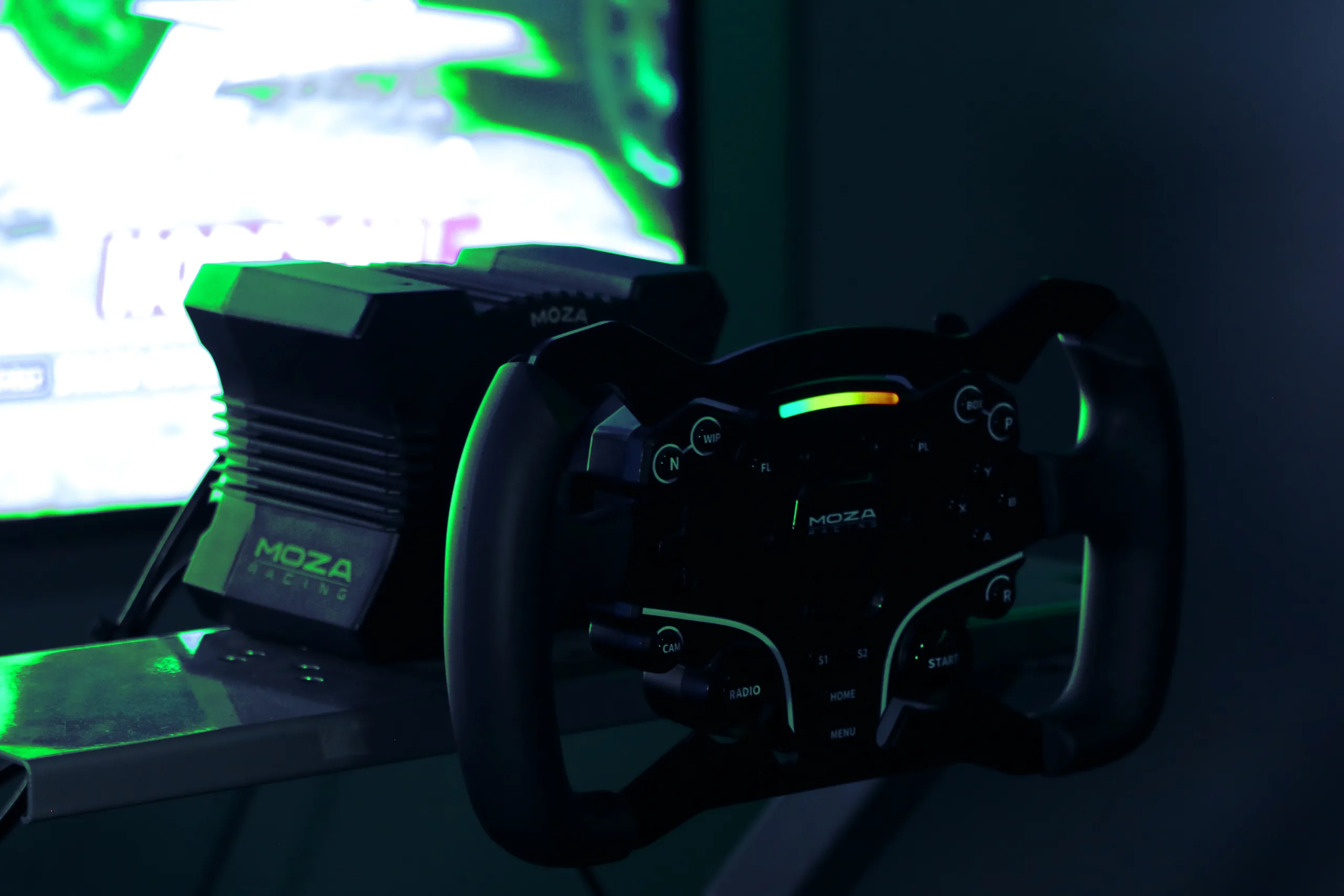 A Moza direct-drive racing wheel glowing green