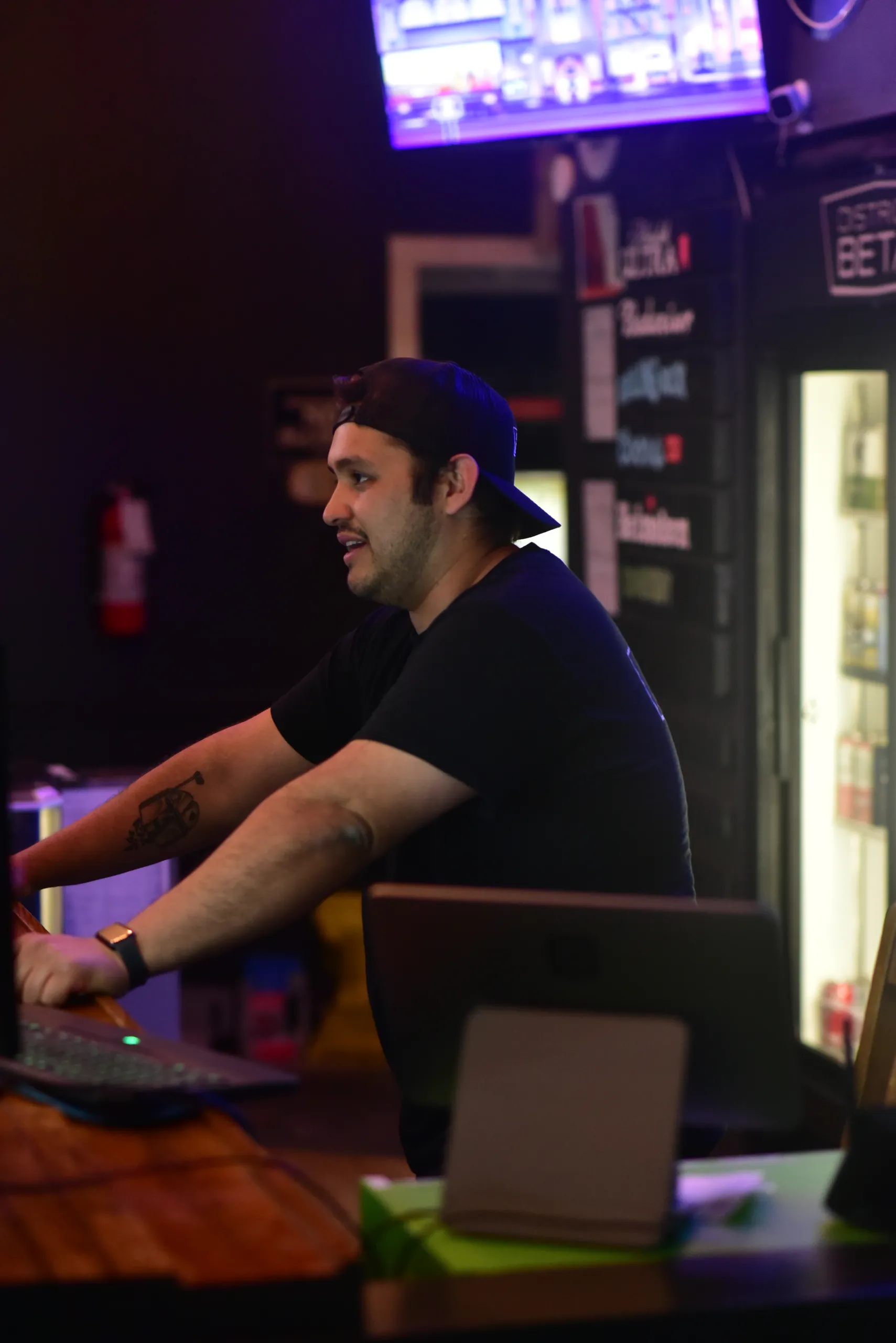 A staff member chatting with guests at the counter
