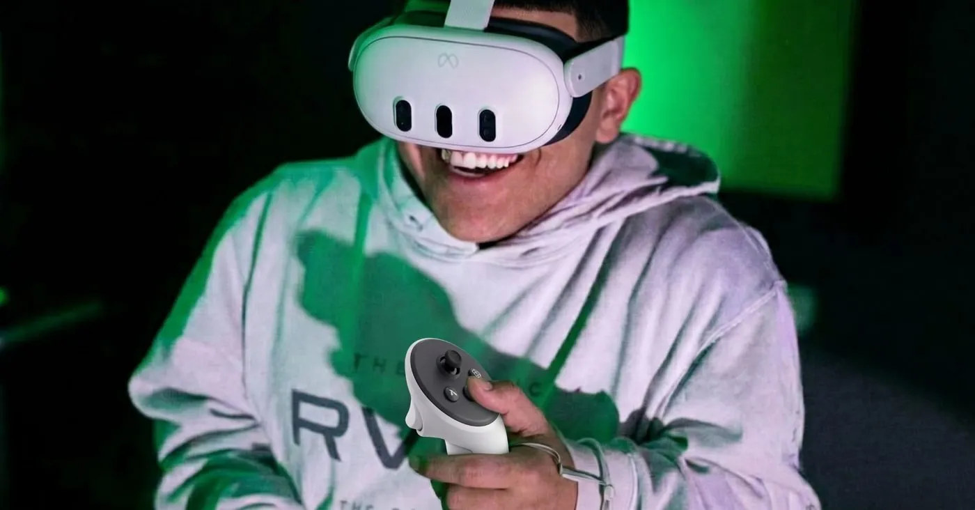 A player grinning in a VR headset